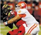  ?? JOE ROBBINS/GETTY PHOTO ?? Maryland quarterbac­k Caleb Rowe, left, being sacked by Clemson’s Josh Watson Saturday, completed 19 of 45 passes.