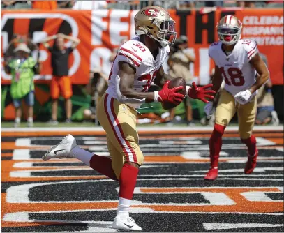  ?? FRANK VICTORES — THE ASSOCIATED PRESS ?? 49ers running back Jeffrey Wilson runs in a touchdown against the Cincinnati Bengals during the first half of Sunday’s 41-17victory.