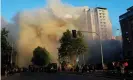  ??  ?? Thick smoke engulfs a street as a shopping mall burns during an anti-government protest in Santiago, Chile, on Monday. Photograph: Henry Romero/Reuters