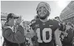  ??  ?? Kansas State quarterbac­k Skylar Thompson (10) walks off the field after last season's upset win against OU. [AP PHOTO/CHARLIE RIEDEL]