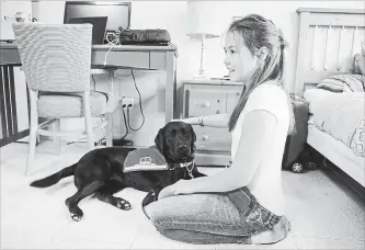  ?? PHOTOS: BEN SINGER THE CANADIAN PRESS ?? Abigail Neill, 11, plays with her new diabetic alert dog, Icelyn, at the Dog Guides Canada facility in Oakville.