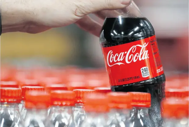  ?? GEORGE FREY / GETTY IMAGES ?? Studies funded by Coca- Cola, PepsiCo and the sugar industry were five times more likely to find no link between sugary drinks and weight gain.