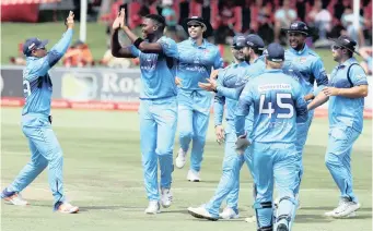  ??  ?? LUNGI Ngidi of the Titans celebrates with his teammates after claiming the wicket of Grant Mokoena of the Knights during their Momentum One-Day Cup match at SuperSport Park yesterday. | BackpagePi­x