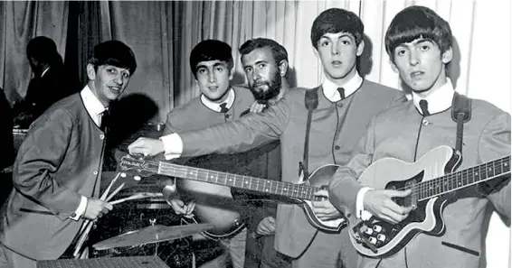  ??  ?? The Fab Four with Royston Ellis (centre) in 1963