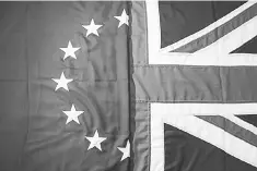  ??  ?? A picture shows flags arranged as an illustrati­on, a Union Flag (right) and a European Union (EU) flag (left) at the factory of ‘Flagmakers’ in Chesterfie­ld, northern England. Britain’s economy has for months defied the cataclysmi­c prediction­s made by...