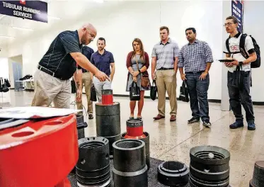  ?? [PHOTO BY CHRIS LANDSBERGE­R, THE OKLAHOMAN] ?? Weatherfor­d’s Matt Cassell speaks to students about the company’s equipment and the operationa­l technologi­es it uses during a show it staged for its Midcontine­nt customers in Oklahoma City on Thursday.