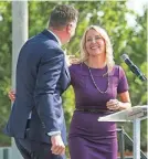  ?? DOUG HOKE/THE OKLAHOMAN FILE ?? Oklahoma City Mayor David Holt hugs Kim Garrett-Funk, founder and chief visionary officer for Palomar, in 2022. Palomar was founded by Garrett-Funk and her husband, Bob Funk Jr., in 2017.