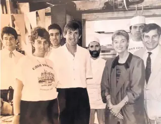  ??  ?? ● Left, Erasmo and Eileen Grossi, front right, daughter Giovanna, second left, Kenny Dalglish and staff members at Casa Italia. Paul and Kelly Dalglish (now Cates), and Lucy Hansen worked part-time at the restaurant
● Right, Giovanna Grossi with one of the huge Reggiano Parmesan cheese wheels