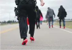  ??  ?? RCMP officers from Prince Albert and the Blaine Lake area also participat­ed in the walk to remember victims of violence.