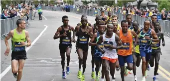  ?? CHris CHristo / Herald staFF File ?? ‘HORRIFIED AND OUTRAGED’: Pictured are the elite runners along mile 20 of the 125th Boston Marathon on Oct. 11, 2021.