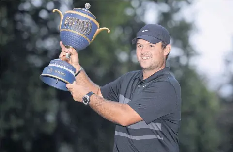  ?? USA TODAY SPORTS ?? Patrick Reed poses with the trophy after winning the WGC-Mexico Championsh­ip.