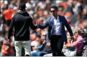  ?? RAY CHAVEZ — BAY AREA NEWS GROUP ?? San Francisco Giants manager Gabe Kapler, left, congratula­tes Giants legend Buster Posey during the Buster Posey Day ceremony before the Giants hosted the St. Louis Cardinals at Oracle Park in San Francisco on Saturday.