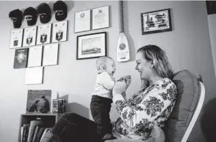  ?? Brett Coomer / Staff photograph­er ?? Ashley Totten, a Coast Guard wife, is feeling the government shutdown’s financial pinch. Maddox, her 3-month-old son, has a heart condition that soon might require expensive surgery.