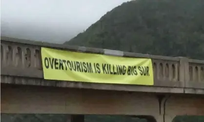  ??  ?? A group called Take Back Big Sur hung the banner, which was taken down after several hours. Photograph: KSBW