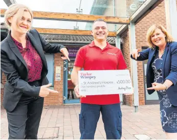  ?? ?? Big boost Hospice outpatient assistant practition­er Scott Watson and trust legacy and individual giving manager Lorna Mccafferty receive the cheque from Taylor Wimpey representa­tive Amanda Ritchie (left)