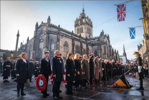  ?? (File Photo/PA/AP/Jane Barlow) ?? First Minister of Scotland Nicola Sturgeon and the Lord Provost of the City of Edinburgh Robert Aldridge attend the Remembranc­e Sunday ceremony Nov. 13 in Edinburgh, Scotland.