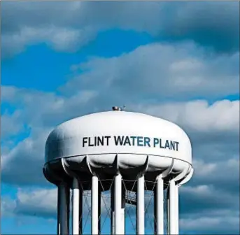  ?? CARLOS OSORIO/AP 2016 ?? Decisions about drinking water in Flint, Mich., were tied to its economic nosedive after General Motors closed shop, depleting Flint’s tax base and ability to repair infrastruc­ture.