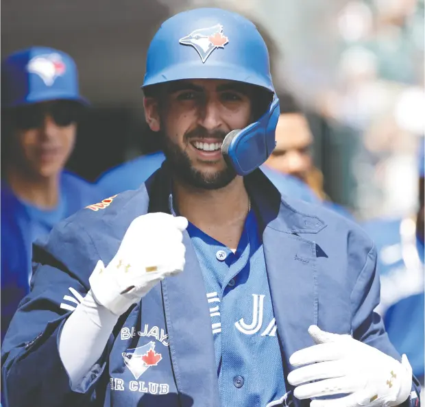  ?? RICK OSENTOSKI / USA TODAY SPORTS ?? Toronto Blue Jays shortstop Kevin Smith celebrates after hitting a home run during Sunday’s 2-1 win over the Detroit Tigers at Comerica Park.