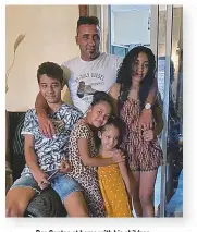  ??  ?? Dos Santos at home with his children.