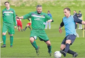  ??  ?? Dryburgh CC (blue) on the ball versus Hilltown Hotspurs.