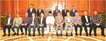  ?? ?? Prime Minister Datuk Seri Anwar Ibrahim (seated centre), Chief Minister Datuk Seri Panglima Haji Hajiji Haji Noor (seated fourth right) and members of the National Energy Council taking one for the album before the meeting.
