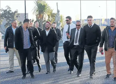  ??  ?? Clockwise from above: Sonny Bill Williams, in jersey, and Piri Weepu, in woollen hat, were among many All Black stars who attended the funeral. Collins’ casket is brought into Te Rauparaha Arena. The arena was overflowin­g.
