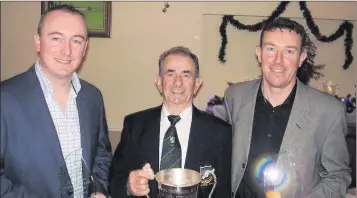  ??  ?? Club Captain Sean O’Connor centre presents Sean O’Reilly and Declan O’Toole with the Club Fourball Matchplay Cup.