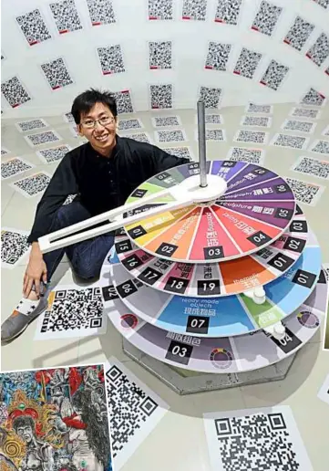  ??  ?? T.C. Liew’s work, WheelOfFor­tune, uses Qr codes interactiv­ely, as a means of accessing universiti Sains Malaysia’s database of works of fine art.