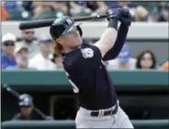  ?? JOHN RAOUX — THE ASSOCIATED PRESS ?? New York Yankees’ Clint Frazier bats against the Detroit Tigers in a spring training baseball game, Saturday in Lakeland, Fla. The top prospect recently cut his hair to fit Yankees rules.