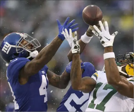  ?? ADAM HUNGER - THE ASSOCIATED PRESS ?? New York Giants’ Antoine Bethea, left breaks up a pass intended for Green Bay Packers’ Davante Adams during the first half of an NFL football game, Sunday, Dec. 1, 2019, in East Rutherford, N.J.