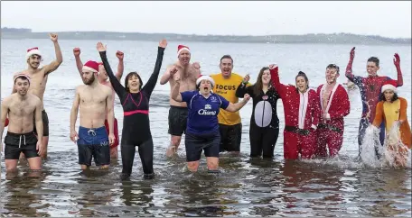  ??  ?? Some of the hardy souls who braved the water at Rosses Point for the annual Christmas Day swim. Pic: Donal Hackett.