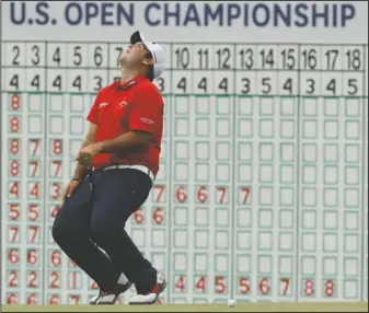  ?? The Associated Press ?? ROUGH FINISH: Patrick Reed reacts after missing a birdie putt on the 18th hole during the third round of the U.S. Open golf tournament Saturday at Erin Hills in Erin, Wis.