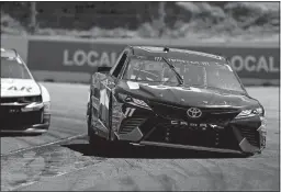  ?? ALVIN JORNADA/THE PRESS DEMOCRAT ?? Denny Hamlin (11) drives through Turn 4 during practice on Friday for a NASCAR Cup race at Sonoma Raceway in Sonoma, Calif.
