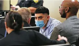  ?? Photos by Jerry Lara / Staff photograph­er ?? Miguel Angel Gutierrez talks with his defense team. The jury didn't agree with the defense contention that the slain boy's mother was responsibl­e.