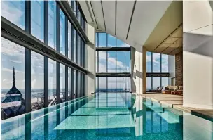  ??  ?? SOAKING UP THE VIEWS:
The pool at Tierra Patagonia looks out towards the snowcapped Torres del Paine HIGH RISE:
The Four Seasons Philadelph­ia infinity pool on the 57th floor