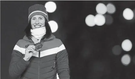  ?? GETTY IMAGES FILE PHOTO ?? Marit Bjorgen with her gold medal in cross-country skiing at Olympic Stadium in February. The 38-year-old won five medals in Pyeongchan­g.