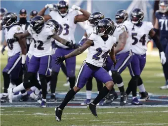  ?? GETTy IMaGES ?? PAYBACK TIME: After the Titans celebrated on Baltimore’s midfield logo earlier this season, the Ravens returned the favor after Marcus Peters, 24, had an intercepti­on.