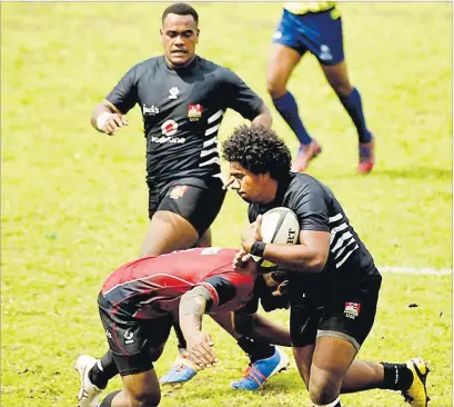  ?? Picture: BA RUGBY ?? Hooker Richard Doughty (with ball) and Sevuloni Nawai in support as the Ba Juniors knocked out Navosa last year.