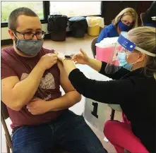  ?? EVAN BRANDT — MEDIANEWS GROUP ?? John Greiner of Harleysvil­le gets a COVID-19vaccinat­ion shot from Liz Fulbright Friday at Bethel Community Church of Pottstown.