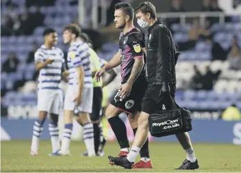  ??  ?? Posh striker Jack Marriott limps out of the game at Reading.