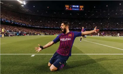  ??  ?? Luis Suárez falls to his knees after opening the scoring for Barcelona aganist Liverpool. Photograph: TF-Images/Getty Images