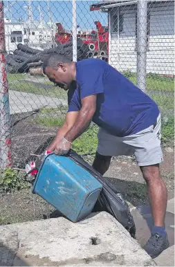  ?? Photos: FPCL ?? Staff members of the Fiji Ports Corporatio­n Limited (FPCL) participat­ing in a clean-up around Port Muaiwalu on October 6, 2018.