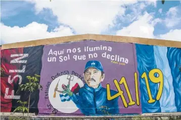  ?? INTI OCON/THE NEW YORK TIMES ?? A mural depicting President Daniel Ortega in Esteli, Nicaragua, bears a slogan quoting the 19th century Nicaraguan poet Ruben Dario that translates as “Here we are illuminate­d by a sun that does not set.”