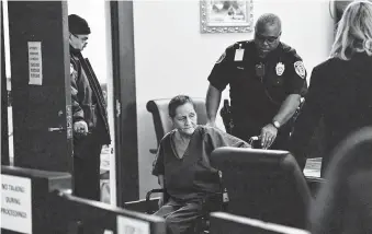  ?? Billy Calzada / Staff photograph­er ?? Beatrice Sampayo, 64, accused of covering up the death of her grandson, is wheeled through the courtroom. Prosecutor­s say she’s a danger to society; the defense says she is too ill be dangerous.