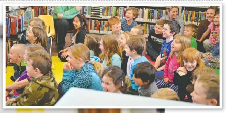  ?? [WHITNEY NEILSON / THE OBSERVER] ?? March Break activities were in full swing this week at the Wellesley Library, where on Tuesday, kids were introduced to lots of animals during a presentati­on by Creature Quest. Here, kids get a good look at an alligator snapping turtle.