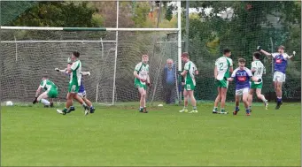  ??  ?? Éire Óg players celebrate when Luke Dorgan fires home immediatel­y after Jack Hanlon’s goal.