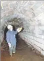  ??  ?? Pottstown Public Works Director Doug Yerger inspects a stormwater arch beneath Pottstown.