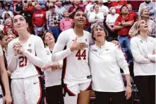  ?? Scott Strazzante/The Chronicle ?? The transfer of Kiki Iriafen, center, to USC is the latest blow to Stanford following the retirement of Tara VanDerveer, right.