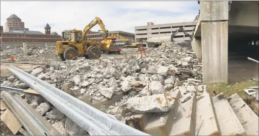  ?? Contribute­d photos ?? Middletown's parking arcade demolition is now about halfway completed. A flat gravel lot will temporaril­y replace the structure on Court Street.