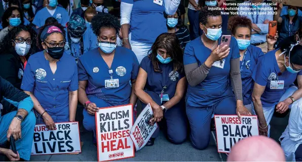  ??  ?? Nurses protest against racial injustice outside Bellevue hospital in New York City on 9 June 2020